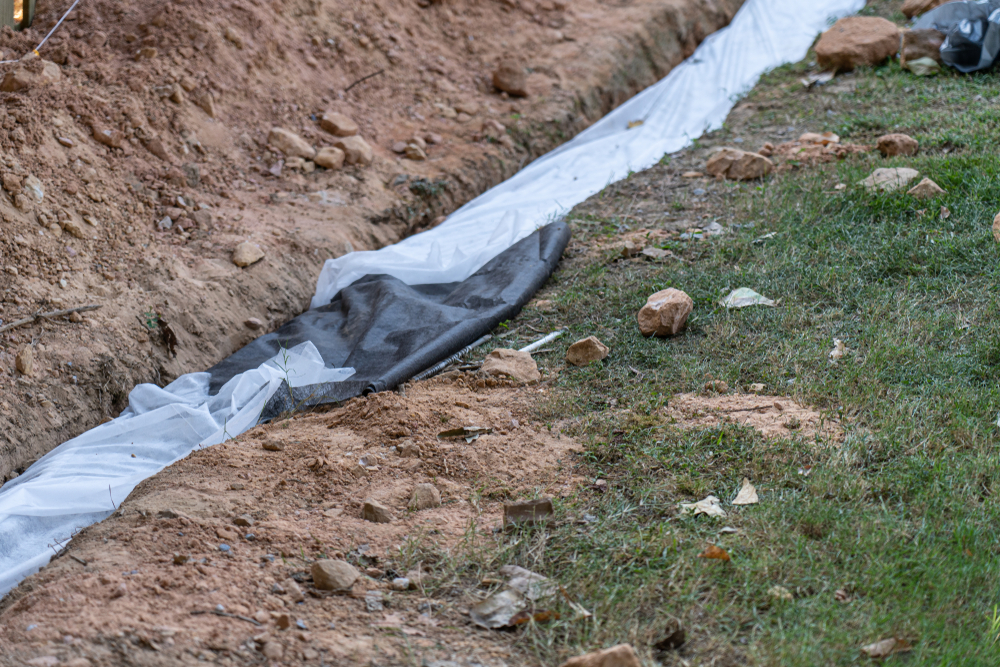 fabric covers drainage rock pipe