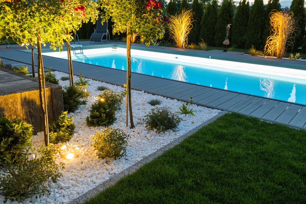 Scenic residential outdoor swimming pool illuminated by led lighting